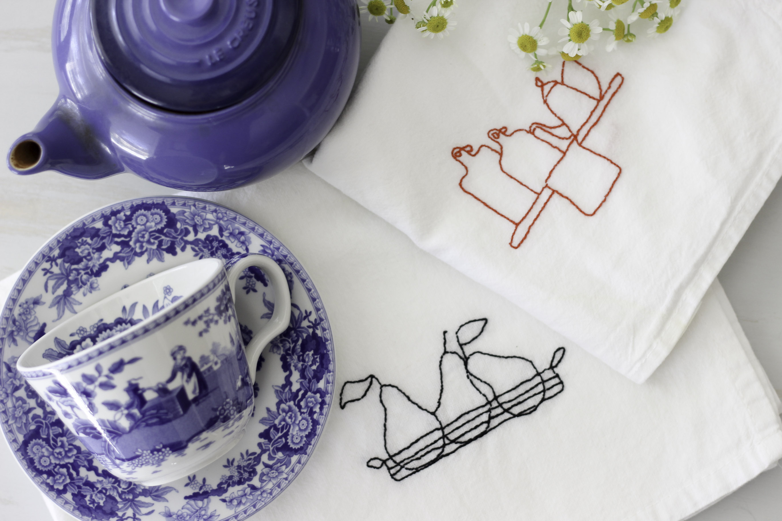 Embroidered tea towels with Aurifloss.